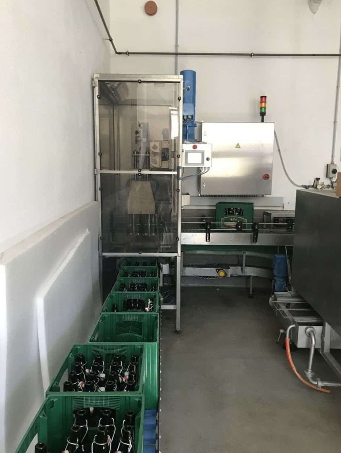 Side view of Nagel, PAC, Juwatec, ICS Returnable Glass Filling line for beer, soft drink