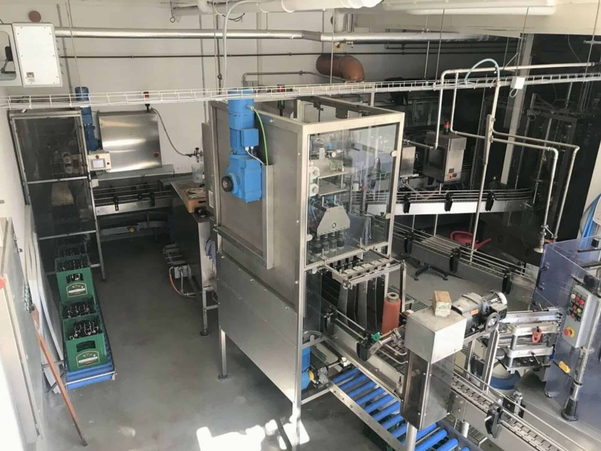 Side view of Nagel, PAC, Juwatec, ICS Returnable Glass Filling line for beer, soft drink