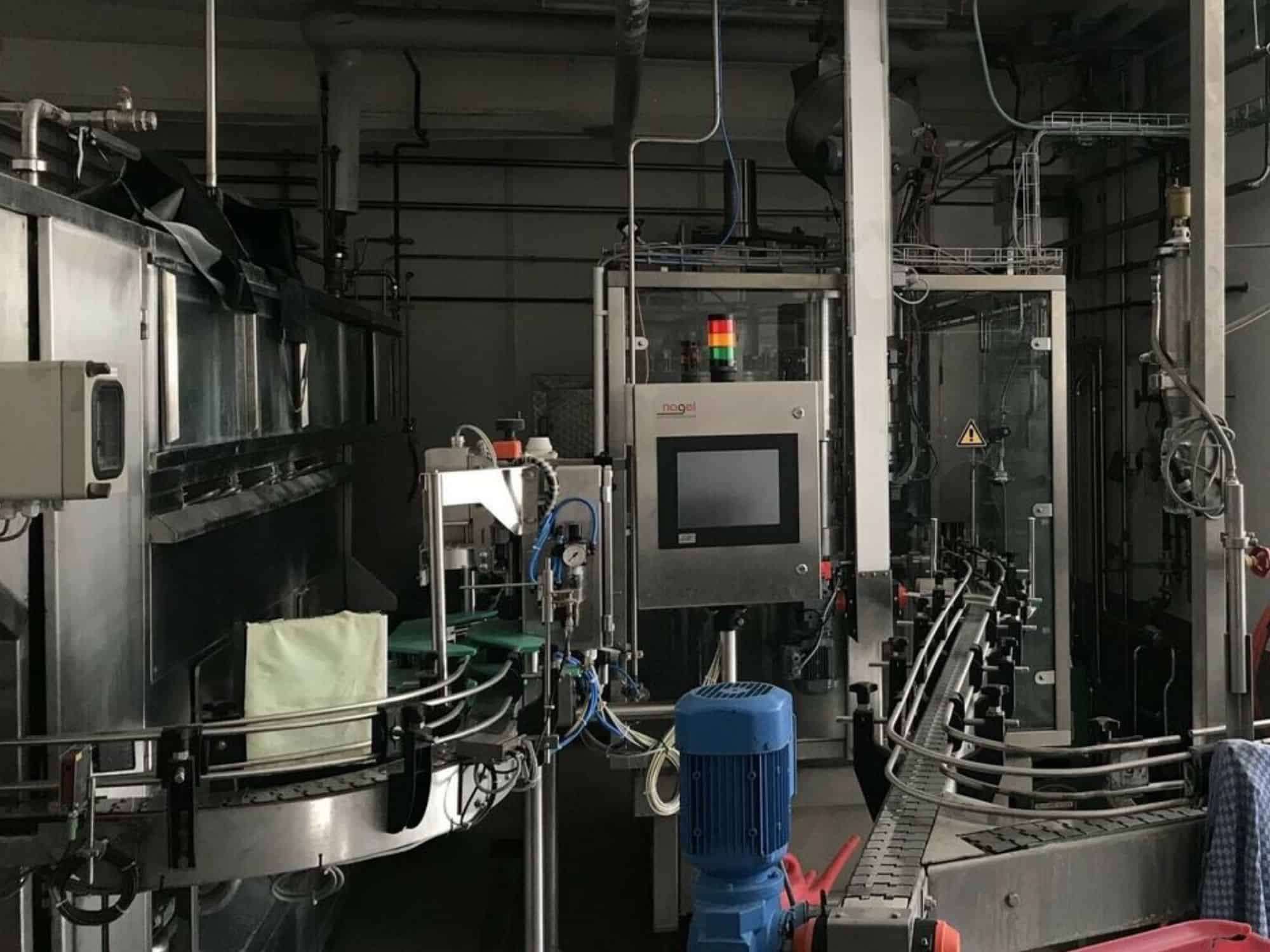 Side view of Nagel, PAC, Juwatec, ICS Returnable Glass Filling line for beer, soft drink