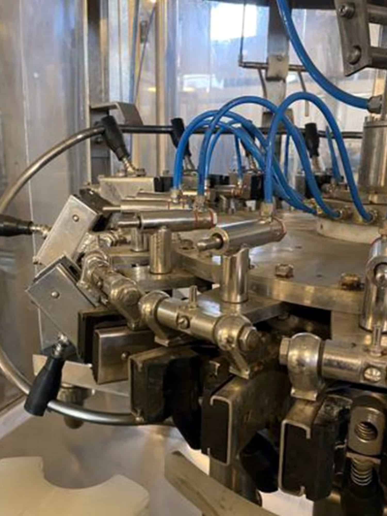 Side view of Melegari TriBlock (rinser, filler, capper)