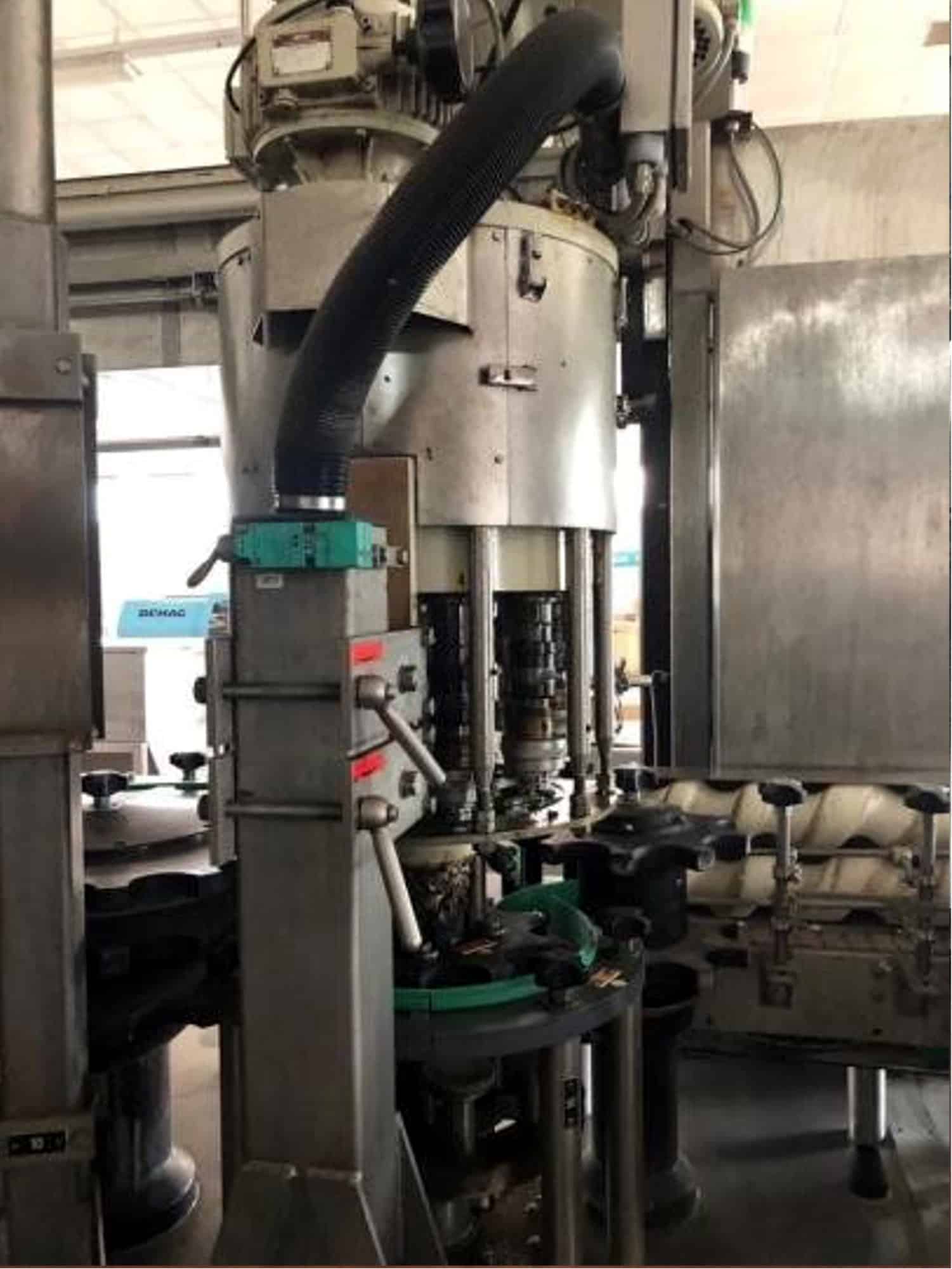Side view of Krones TriBlock (rinser, filler, capper)