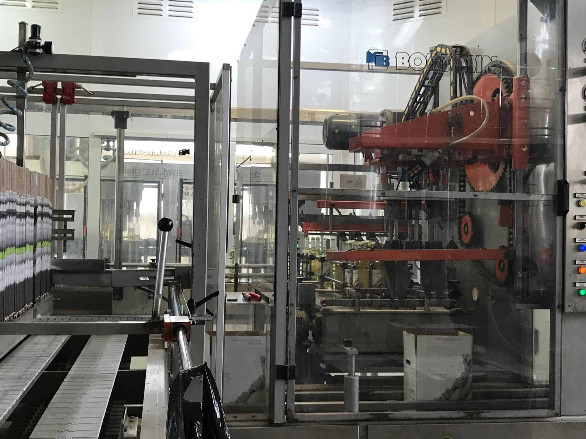 Side view of Cortelazzi Fintec Arol Disposable glass line for wine and spirits