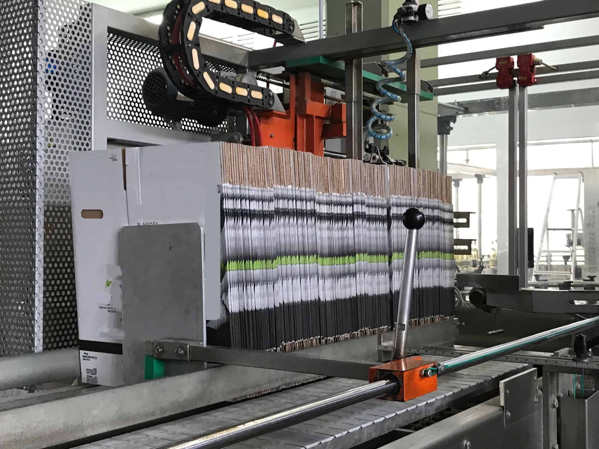 Side view of Cortelazzi Fintec Arol Disposable glass line for wine and spirits