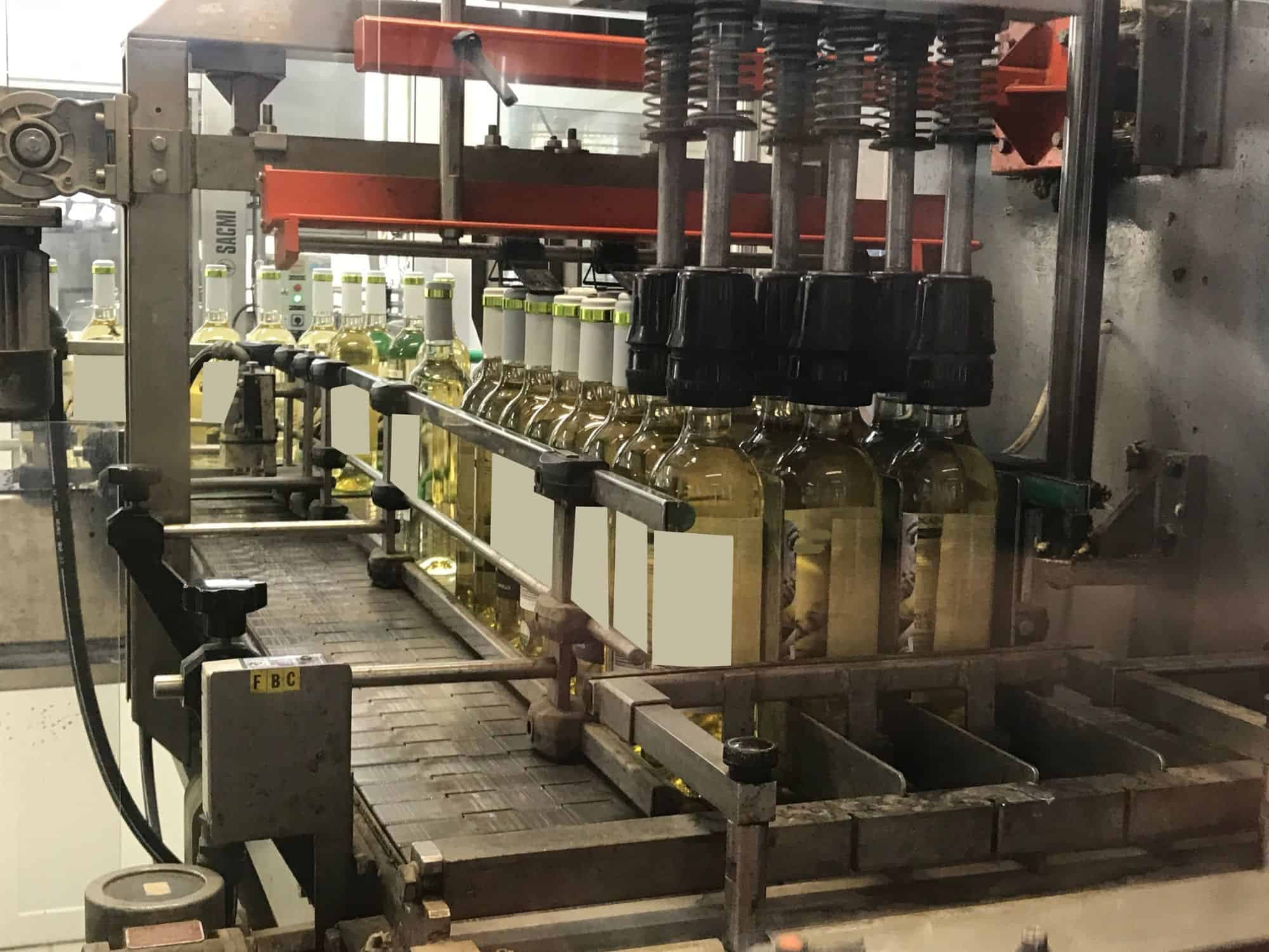 Working room of Cortelazzi Fintec Arol Disposable glass line for wine and spirits