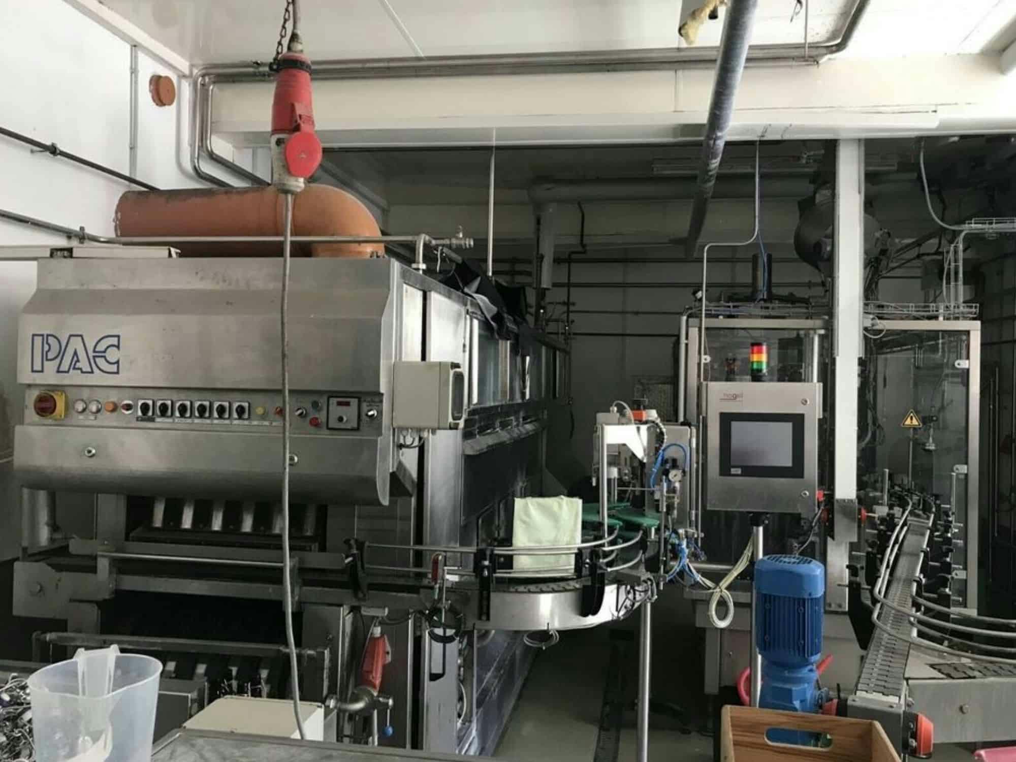 Side view of Nagel, PAC, Juwatec, ICS Returnable Glass Filling line for beer, soft drink