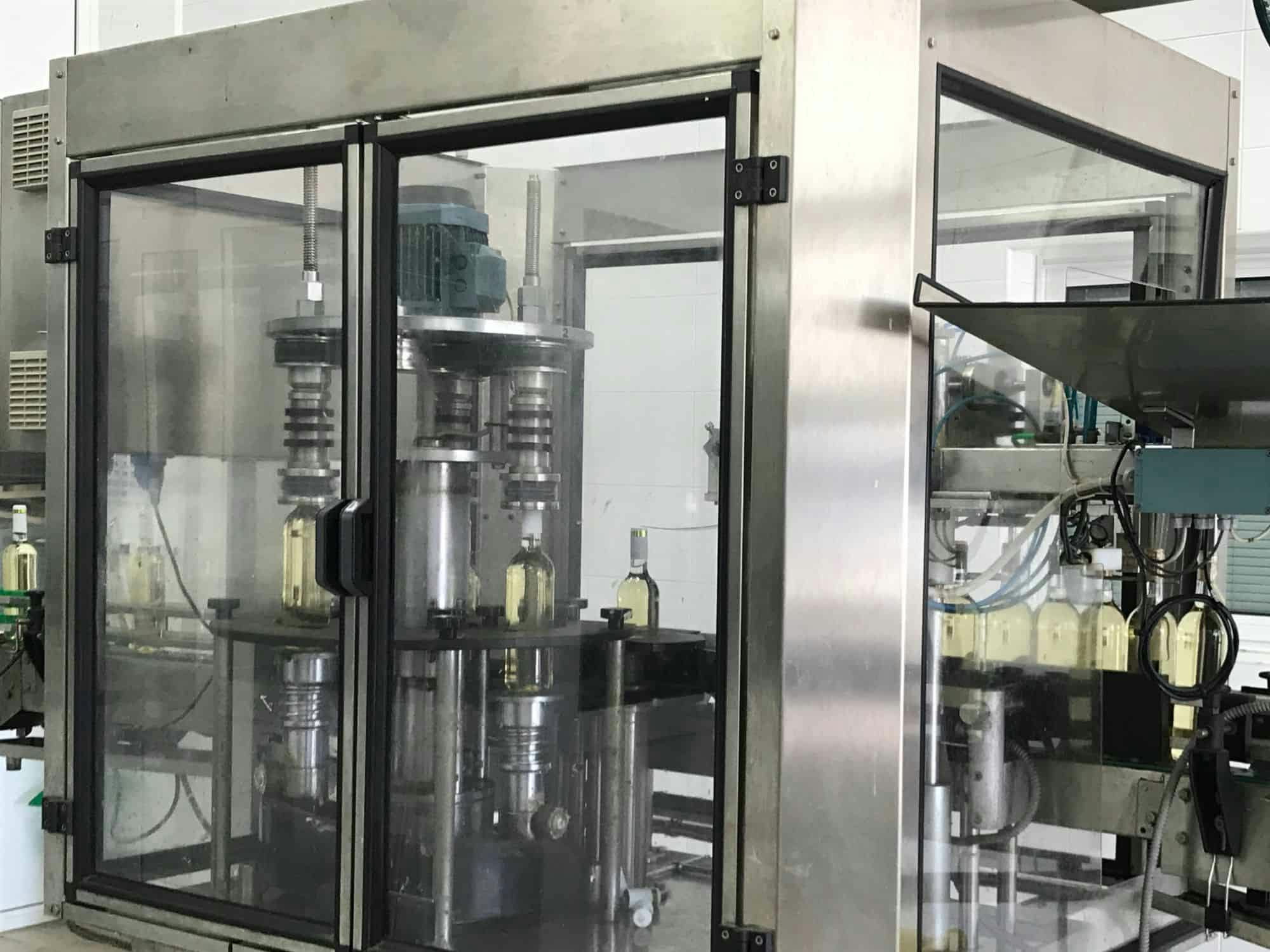 Left view of Cortelazzi Fintec Arol Disposable glass line for wine and spirits